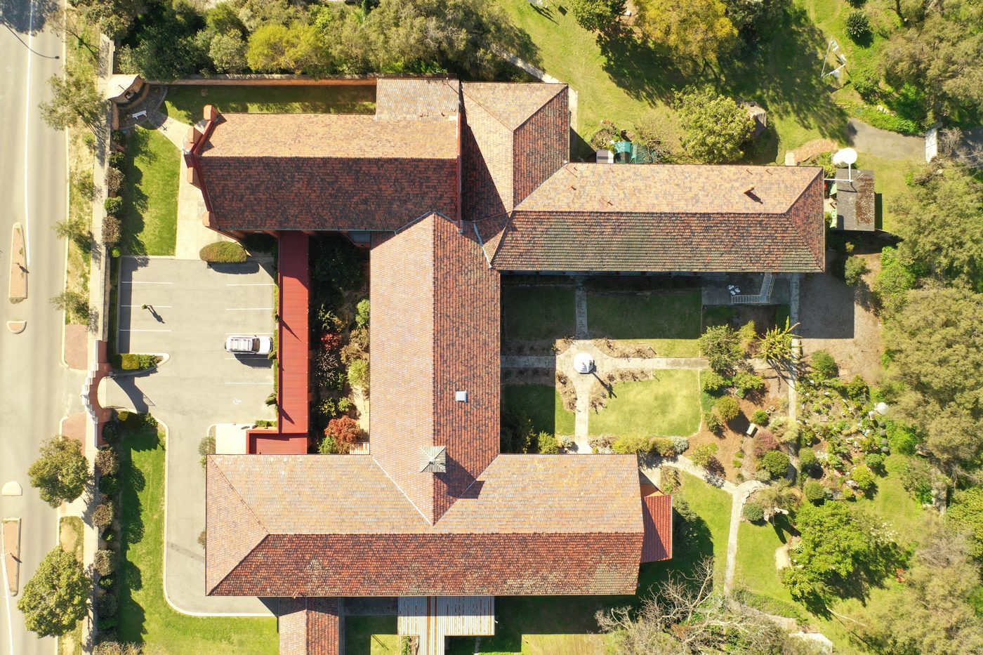 Aerial inspection view of a tiled roof and building courtyard